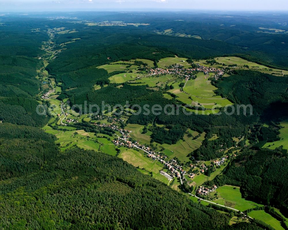 Ober-Hainbrunn from the bird's eye view: Village - view on the edge of forested areas in Ober-Hainbrunn in the state Hesse, Germany