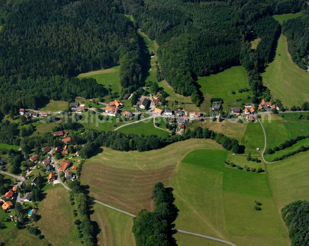 Olfen from the bird's eye view: Village - view on the edge of forested areas in Olfen in the state Hesse, Germany