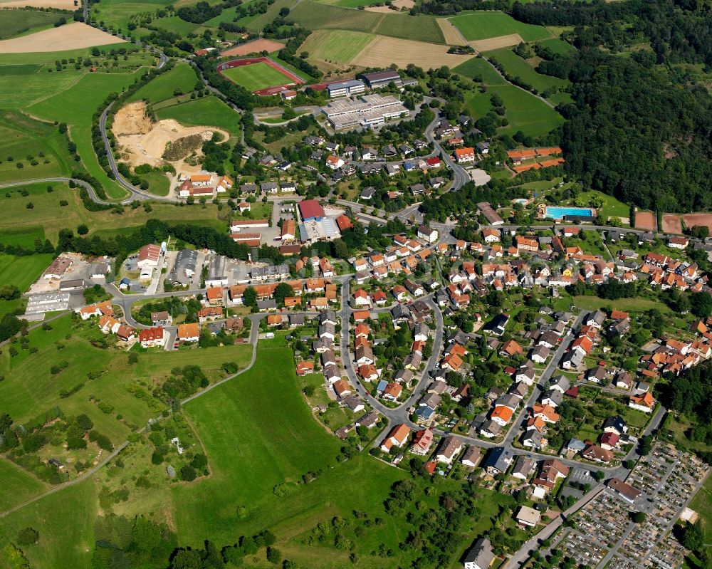 Reichelsheim (Odenwald) from the bird's eye view: Village - view on the edge of forested areas in Reichelsheim (Odenwald) in the state Hesse, Germany