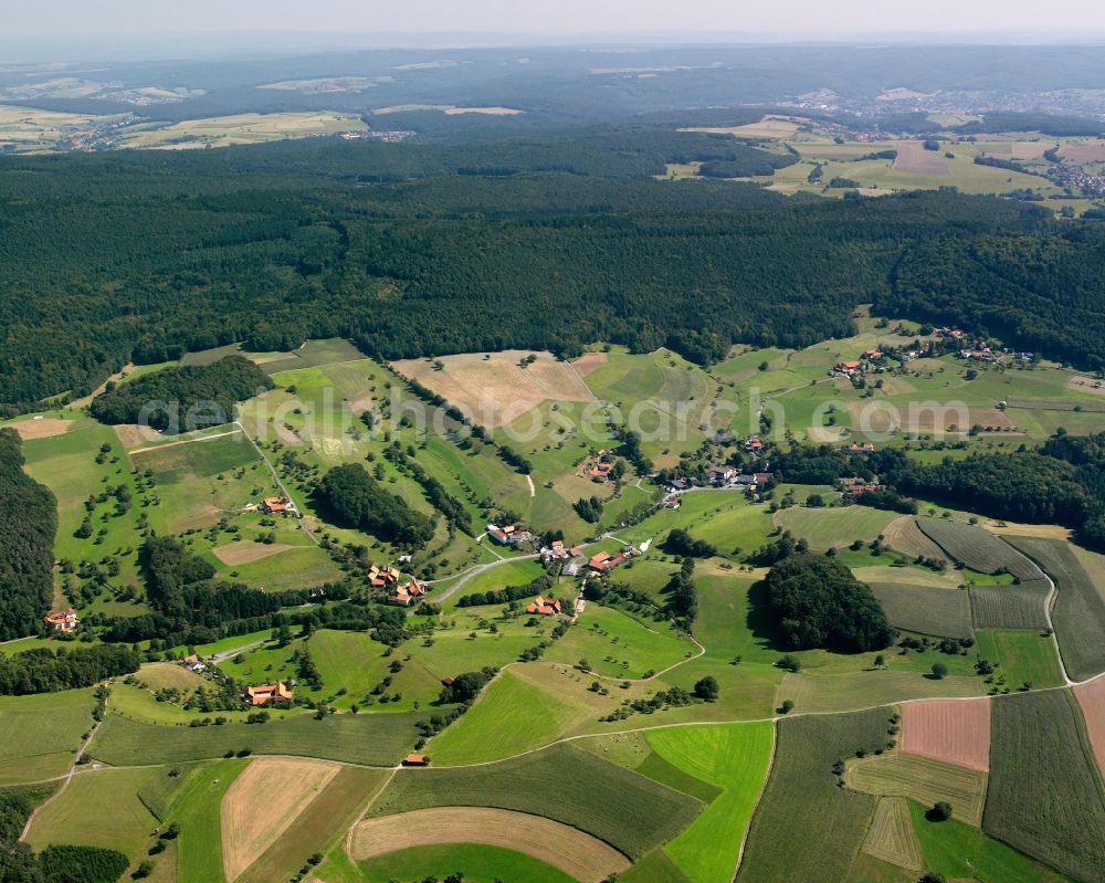 Rohrbach from the bird's eye view: Village - view on the edge of forested areas in Rohrbach in the state Hesse, Germany