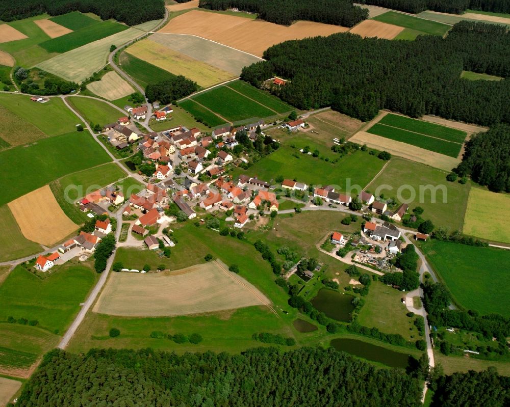 Aerial image Sauernheim - Village - view on the edge of forested areas in Sauernheim in the state Bavaria, Germany