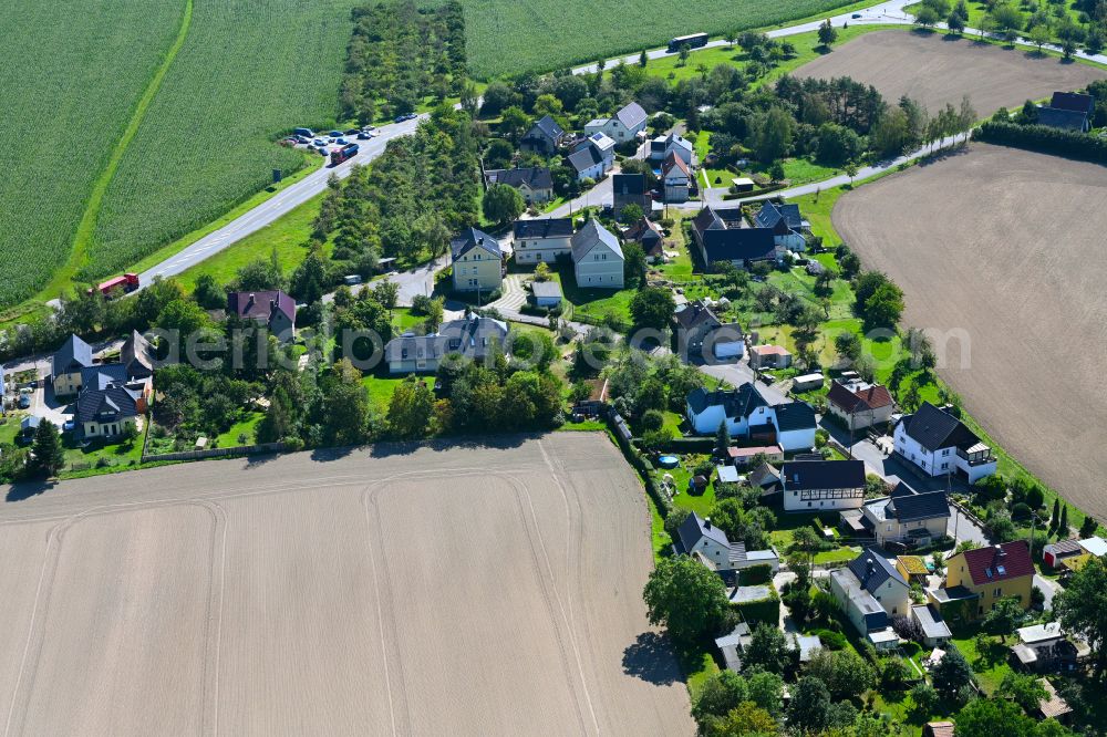 Schönhaide from the bird's eye view: Village - view on the edge of forested areas in Schönhaide in the state Thuringia, Germany