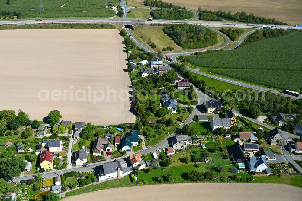 Schönhaide from the bird's eye view: Village - view on the edge of forested areas in Schönhaide in the state Thuringia, Germany