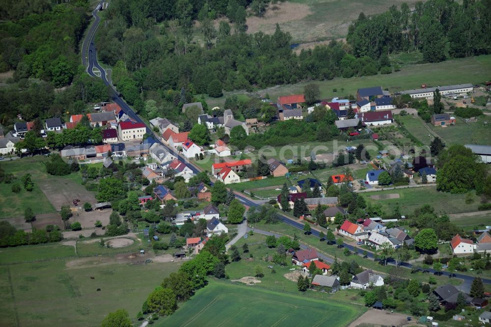 Stangenhagen from the bird's eye view: Village - view on the edge of forested areas in Stangenhagen in the state Brandenburg, Germany