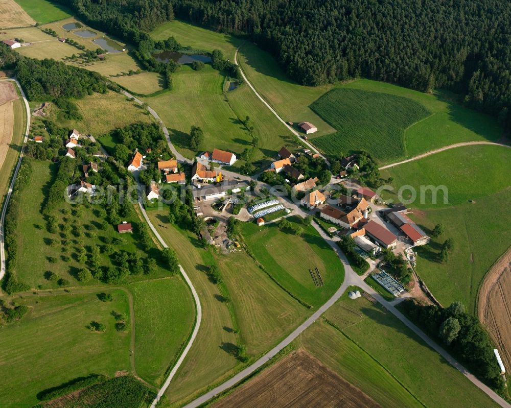 Steinbach from the bird's eye view: Village - view on the edge of forested areas in Steinbach in the state Bavaria, Germany