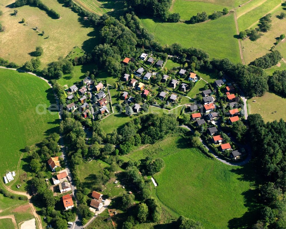 Stierbach from above - Village - view on the edge of forested areas in Stierbach in the state Hesse, Germany