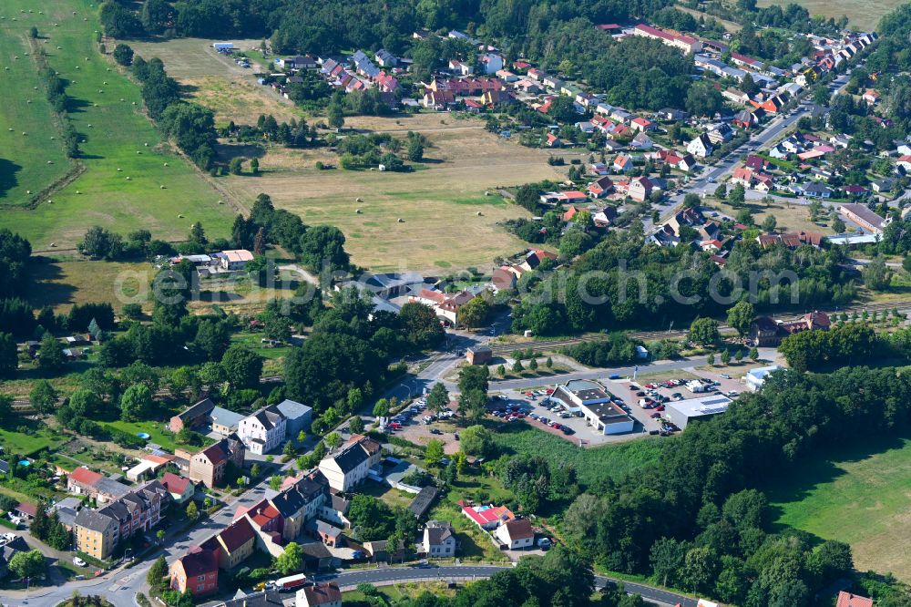 Treuenbrietzen from the bird's eye view: Village - view on the edge of forested areas in Treuenbrietzen in the state Brandenburg, Germany