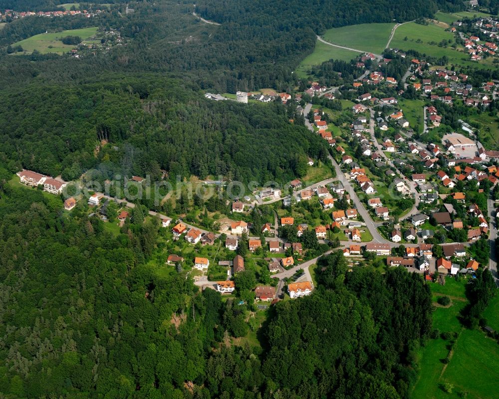 Wüstenrot from the bird's eye view: Village - view on the edge of forested areas in Wüstenrot in the state Baden-Wuerttemberg, Germany