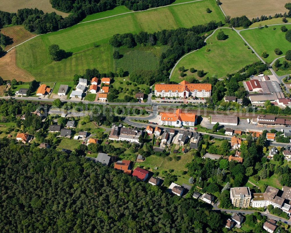 Zell from the bird's eye view: Village - view on the edge of forested areas in Zell in the state Hesse, Germany