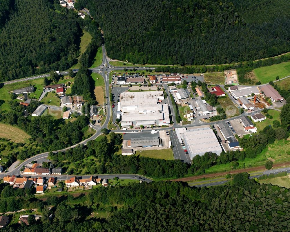 Zell from the bird's eye view: Village - view on the edge of forested areas in Zell in the state Hesse, Germany