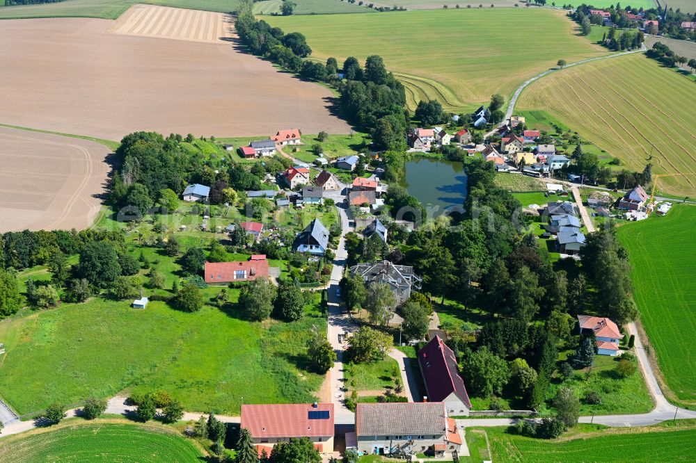 Zweitschen from the bird's eye view: Village - view on the edge of forested areas in Zweitschen in the state Thuringia, Germany