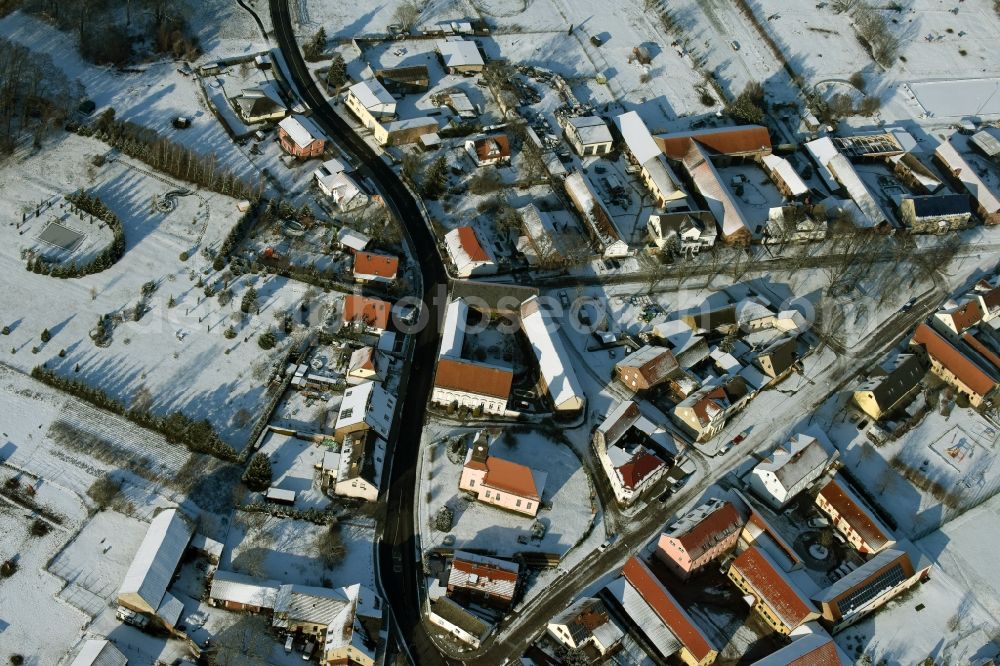 Ludwigsfelde from the bird's eye view: Wintry snowy village view of Wietstock in the state Brandenburg