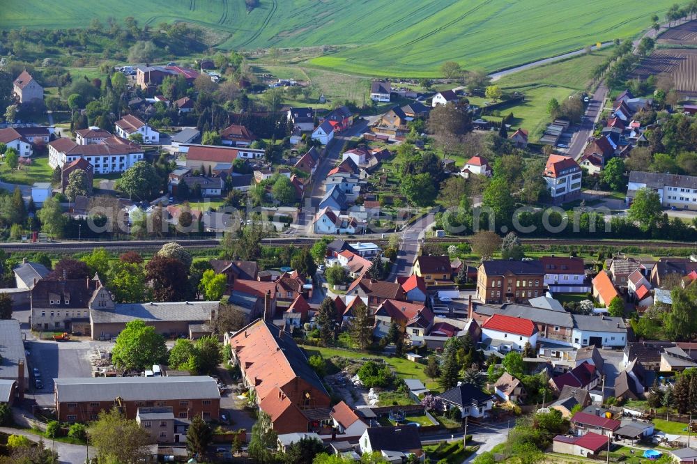 Aerial photograph Belleben - Agricultural land and field borders surround the settlement area of the village in Belleben in the state Saxony-Anhalt, Germany