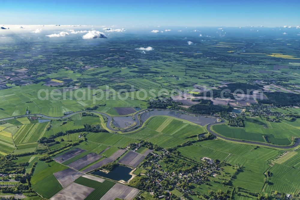 Aerial image Blumenthal - Agricultural land and field boundaries surround the settlement area of the village in Blumenthal in the state Lower Saxony, Germany