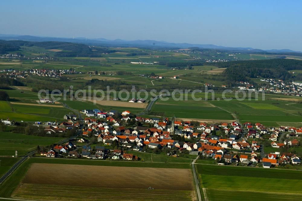 Aerial image Thalau - Agricultural land and field borders surround the settlement area of the village in Thalau in the state Hesse, Germany