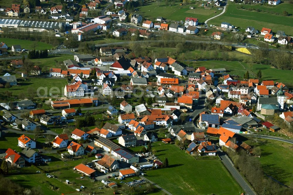 Aerial image Thalau - Agricultural land and field borders surround the settlement area of the village in Thalau in the state Hesse, Germany