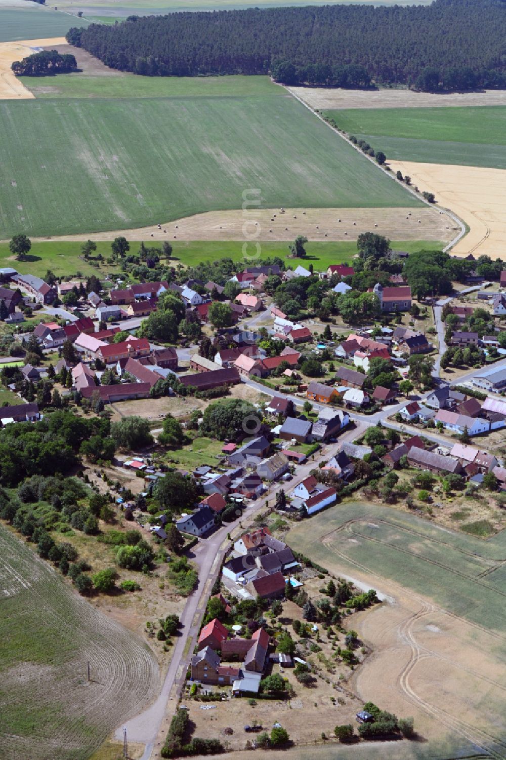 Bad Schmiedeberg from above - Agricultural land and field boundaries surround the settlement area of the village in the district Meuro in Bad Schmiedeberg in the state Saxony-Anhalt, Germany