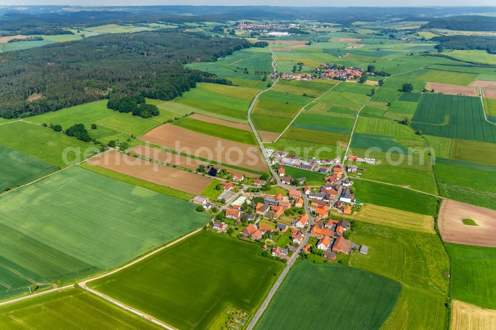 Aerial image Ammenhausen - Agricultural land and field borders surround the settlement area of the village in Ammenhausen in the state Hesse, Germany