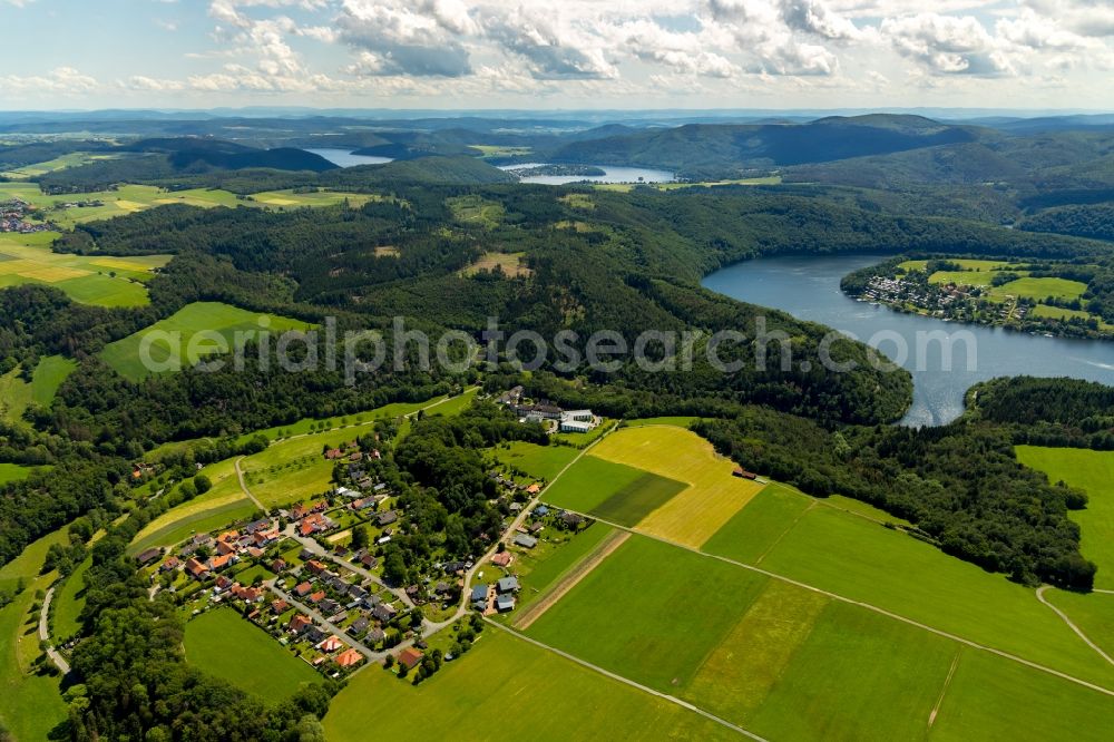 Aerial image Asel - Agricultural land and field borders surround the settlement area of the village in Asel in the state Hesse, Germany