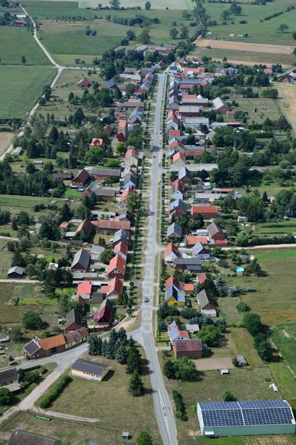 Aerial image Barenthin - Agricultural land and field borders surround the settlement area of the village in Barenthin in the state Brandenburg, Germany