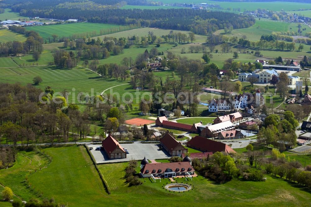 Aerial image Basedow - Agricultural land and field borders surround the settlement area of the village in Basedow in the state Mecklenburg - Western Pomerania, Germany