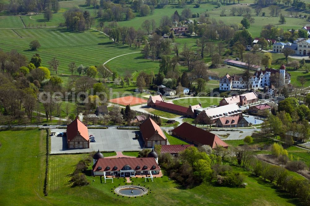 Aerial photograph Basedow - Agricultural land and field borders surround the settlement area of the village in Basedow in the state Mecklenburg - Western Pomerania, Germany