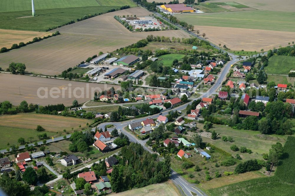 Bückwitz from the bird's eye view: Agricultural land and field borders surround the settlement area of the village in Bueckwitz in the state Brandenburg, Germany