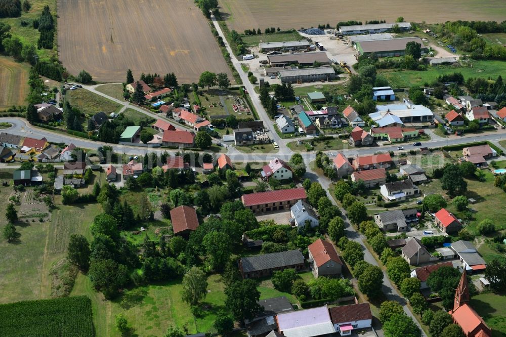 Aerial image Bückwitz - Agricultural land and field borders surround the settlement area of the village in Bueckwitz in the state Brandenburg, Germany