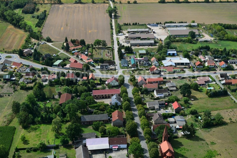 Aerial photograph Bückwitz - Agricultural land and field borders surround the settlement area of the village in Bueckwitz in the state Brandenburg, Germany