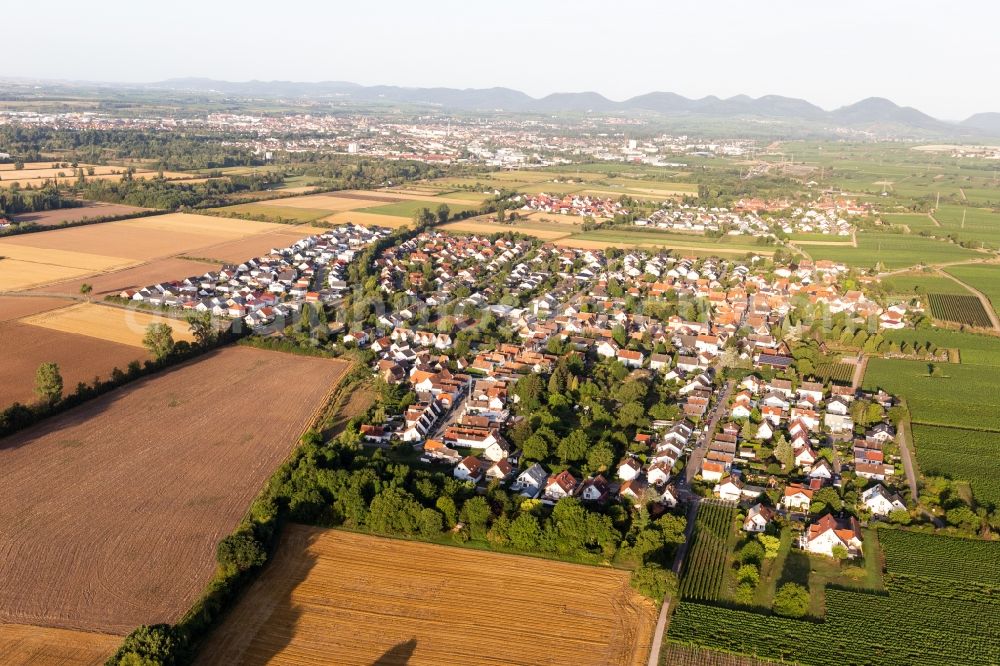 Bornheim from above - Agricultural land and field borders surround the settlement area of the village in Bornheim in the state Rhineland-Palatinate, Germany