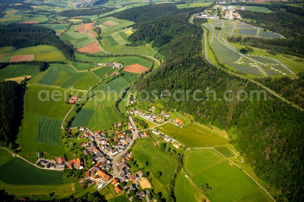 Aerial image Braunsen - Agricultural land and field borders surround the settlement area of the village in Braunsen in the state Hesse, Germany