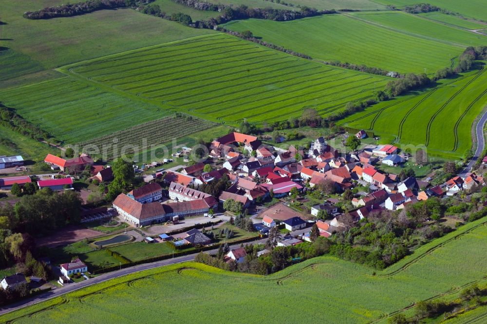 Drebsdorf from the bird's eye view: Agricultural land and field borders surround the settlement area of the village in Drebsdorf in the state Saxony-Anhalt, Germany