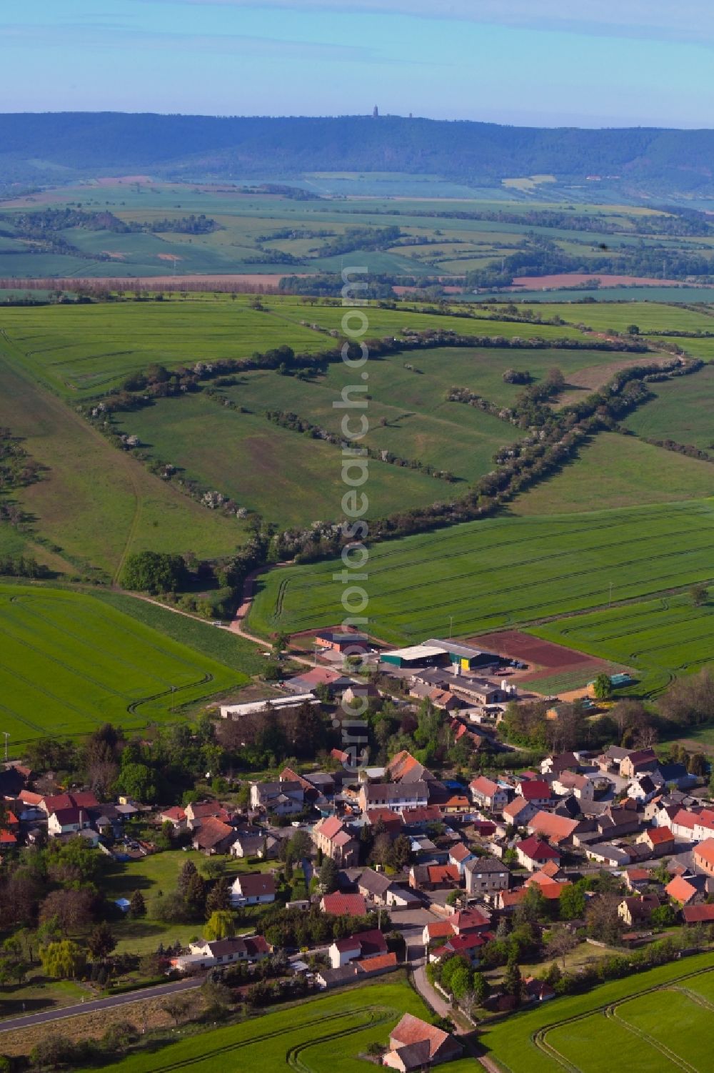 Drebsdorf from above - Agricultural land and field borders surround the settlement area of the village in Drebsdorf in the state Saxony-Anhalt, Germany