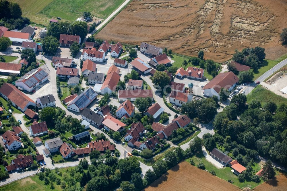 Fahrenzhausen from above - Agricultural land and field borders surround the settlement area of the village in Fahrenzhausen in the state Bavaria, Germany