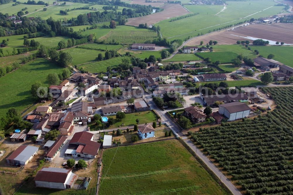 Aerial image Falzoni - Agricultural land and field borders surround the settlement area of the village in Falzoni in the Lombardy, Italy