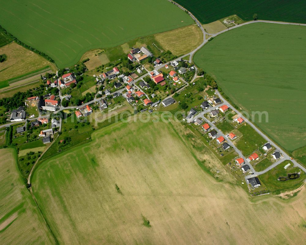 Albersdorf from above - Agricultural land and field boundaries surround the settlement area of the village in Albersdorf in the state Thuringia, Germany