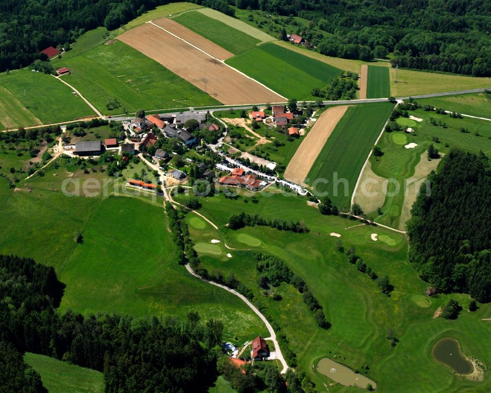 Alfdorf from above - Agricultural land and field boundaries surround the settlement area of the village in Alfdorf in the state Baden-Wuerttemberg, Germany