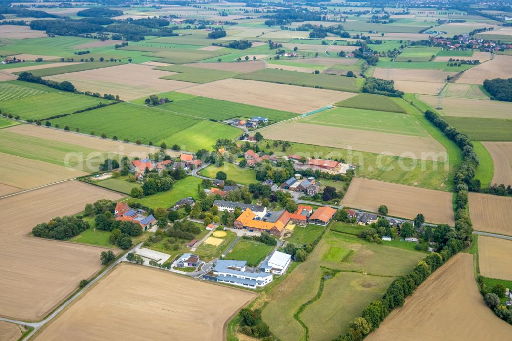 Allen from above - Agricultural land and field boundaries surround the settlement area of the village in Allen in the state North Rhine-Westphalia, Germany