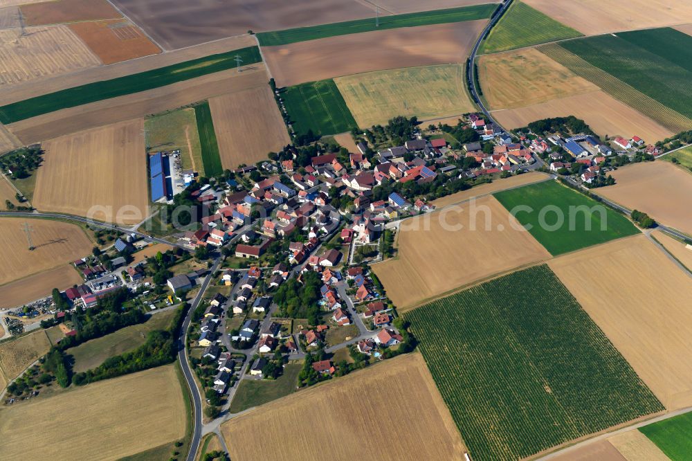 Allersheim from above - Agricultural land and field boundaries surround the settlement area of the village in Allersheim in the state Bavaria, Germany