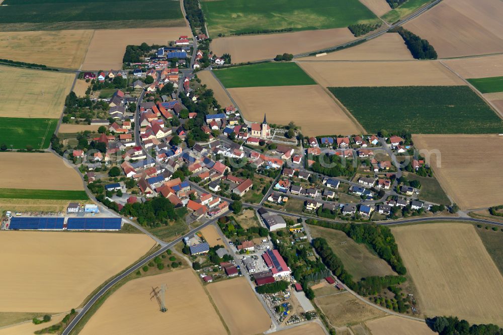 Allersheim from the bird's eye view: Agricultural land and field boundaries surround the settlement area of the village in Allersheim in the state Bavaria, Germany