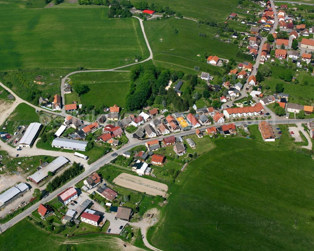 Allrode from above - Agricultural land and field boundaries surround the settlement area of the village in Allrode in the state Saxony-Anhalt, Germany