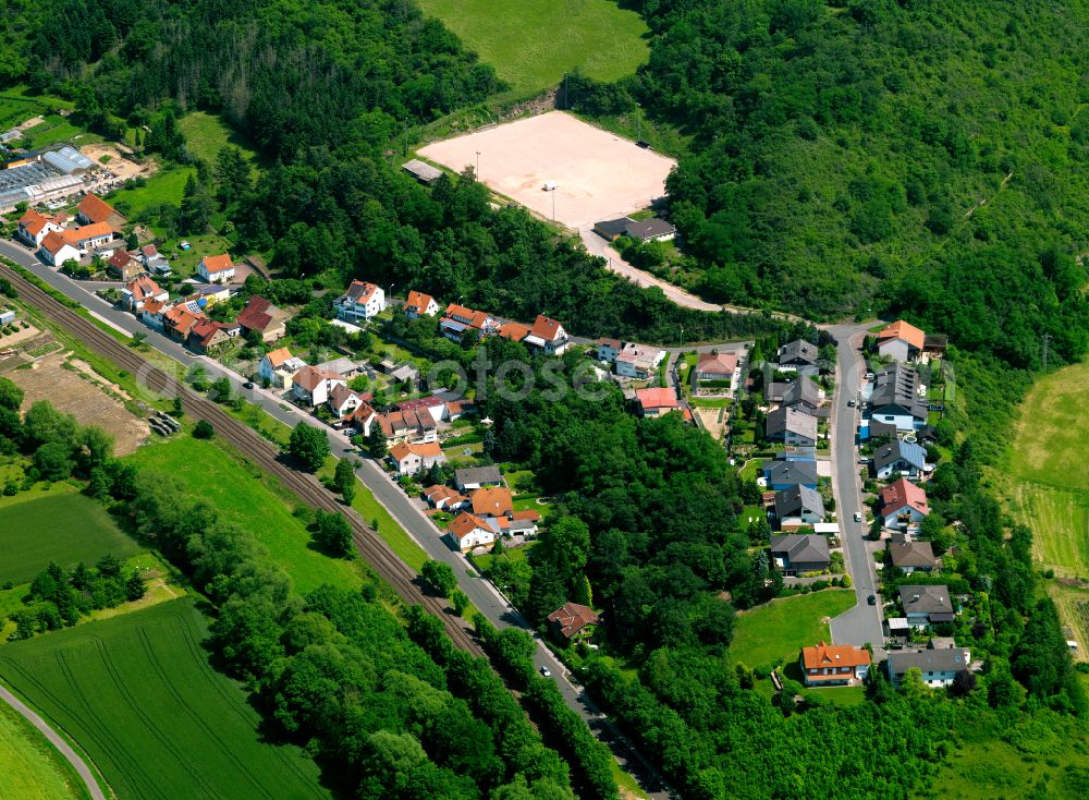 Alsenz from above - Agricultural land and field boundaries surround the settlement area of the village in Alsenz in the state Rhineland-Palatinate, Germany