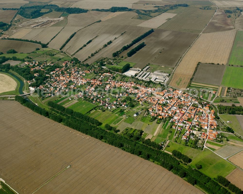 Altengottern from above - Agricultural land and field boundaries surround the settlement area of the village in Altengottern in the state Thuringia, Germany