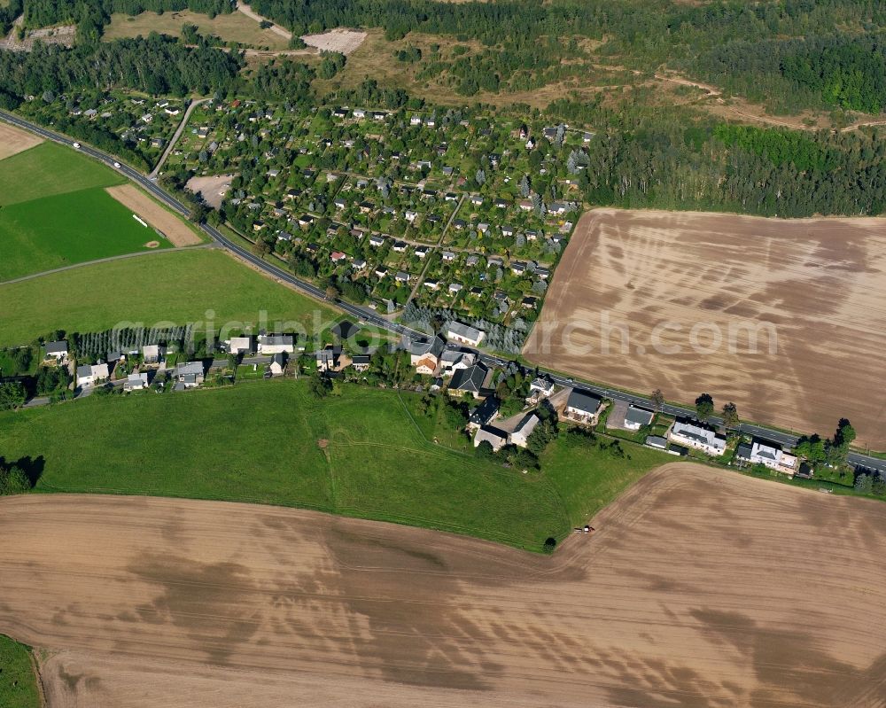 Altenhain from the bird's eye view: Agricultural land and field boundaries surround the settlement area of the village in Altenhain in the state Saxony, Germany