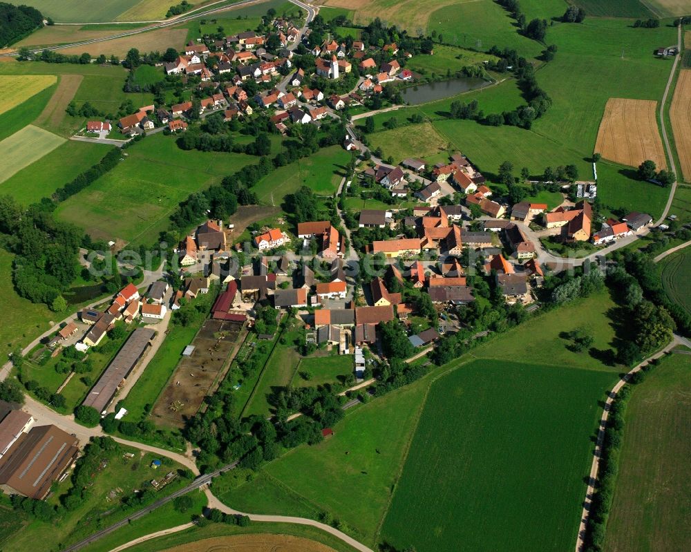 Altentrüdingen from above - Agricultural land and field boundaries surround the settlement area of the village in Altentrüdingen in the state Bavaria, Germany