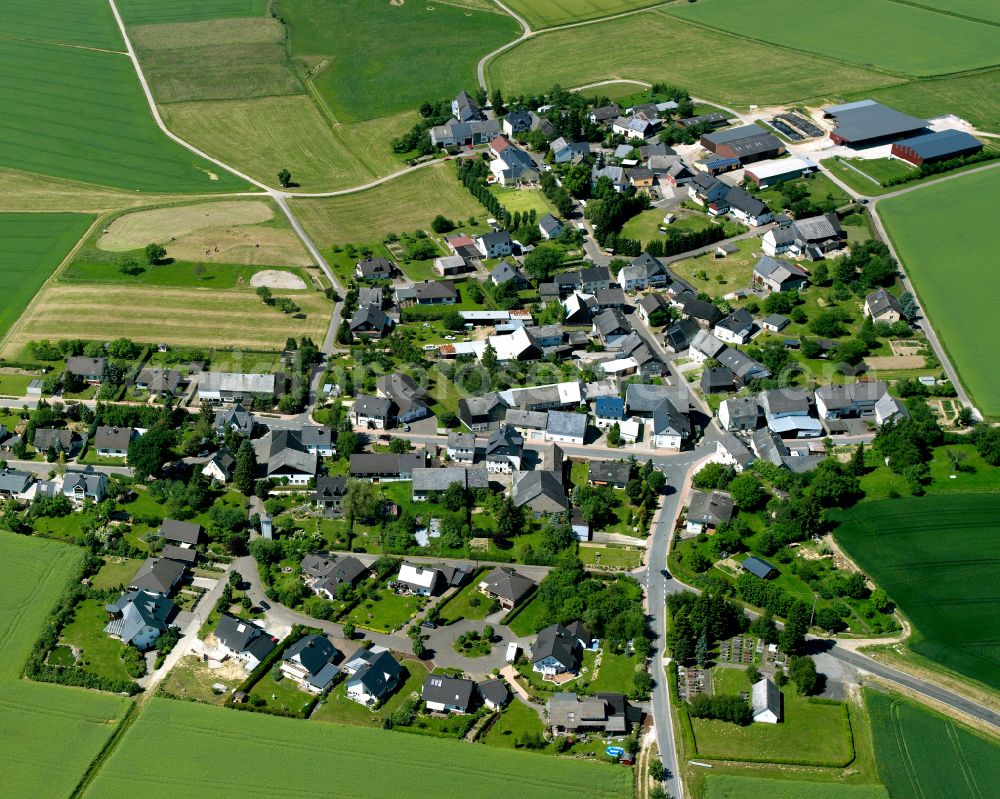 Aerial image Altweidelbach - Agricultural land and field boundaries surround the settlement area of the village in Altweidelbach in the state Rhineland-Palatinate, Germany