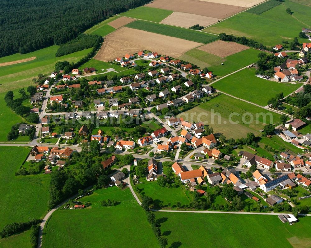 Ammelbruch from above - Agricultural land and field boundaries surround the settlement area of the village in Ammelbruch in the state Bavaria, Germany