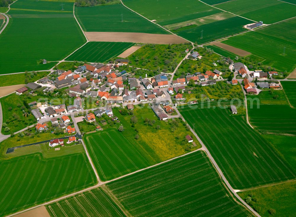 Amstetten from the bird's eye view: Agricultural land and field boundaries surround the settlement area of the village in Amstetten in the state Baden-Wuerttemberg, Germany