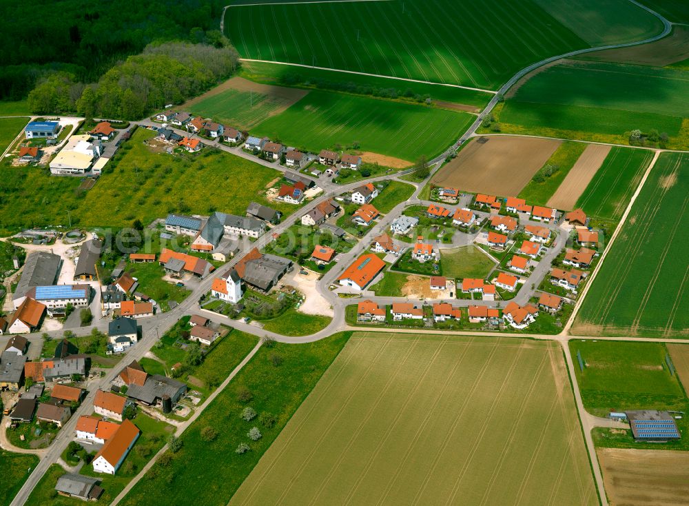 Aerial photograph Amstetten - Agricultural land and field boundaries surround the settlement area of the village in Amstetten in the state Baden-Wuerttemberg, Germany