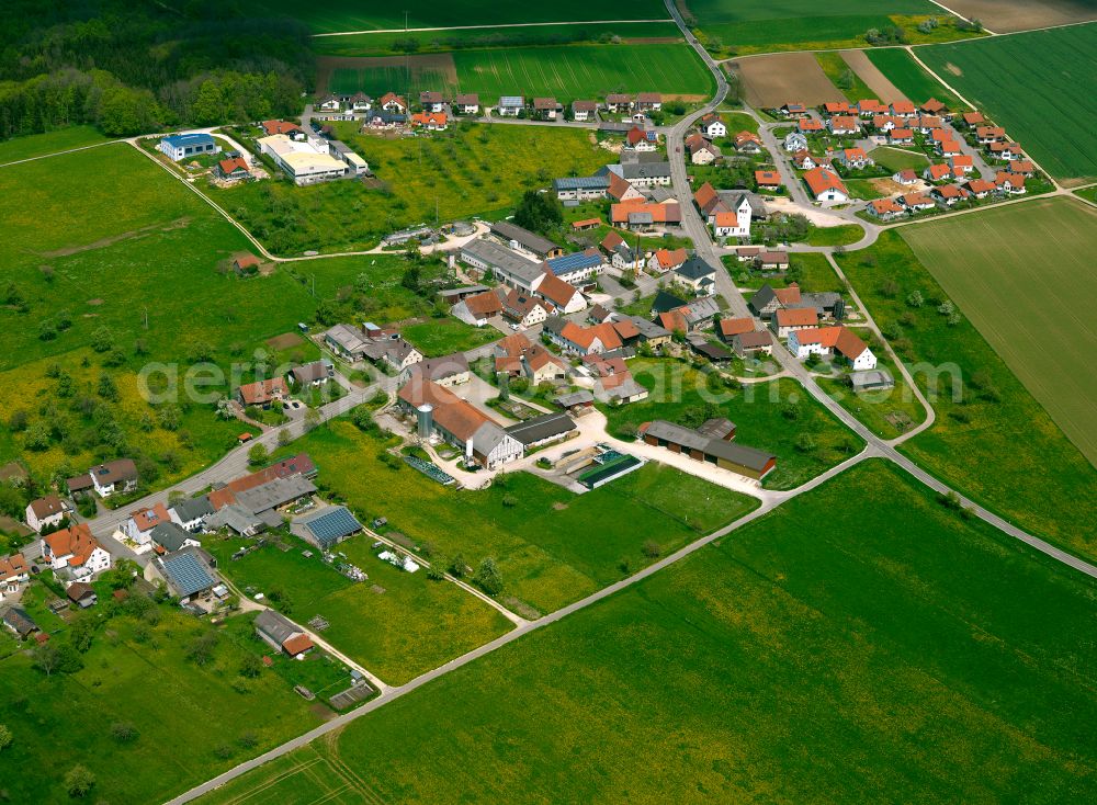 Amstetten from above - Agricultural land and field boundaries surround the settlement area of the village in Amstetten in the state Baden-Wuerttemberg, Germany